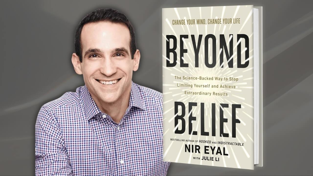 author Nir Eyal with the cover of his book Beyond Belief